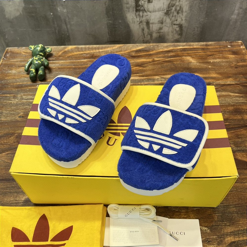 blue and yellow gucci slides