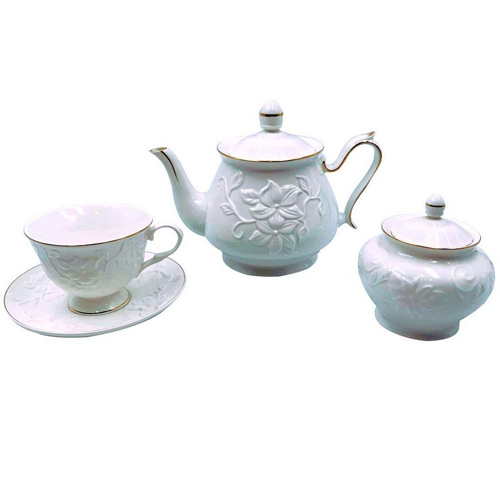 Uma mesa com um jogo de chá e um bule com xícaras de chá.
