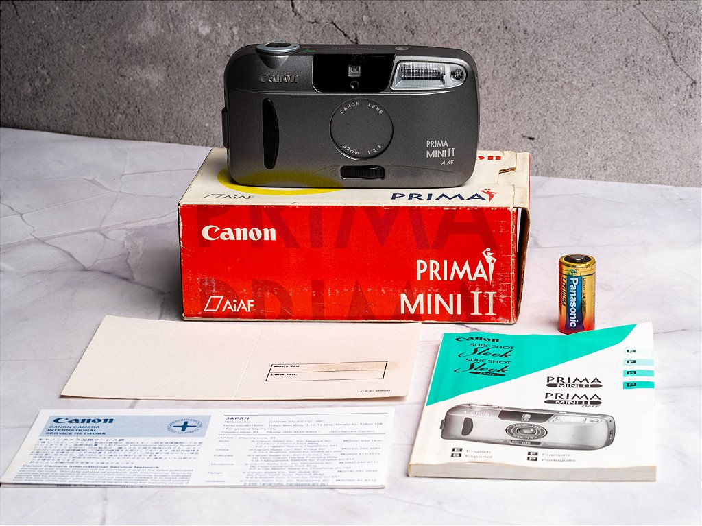 Câmera 35mm - Canon Prima Mini II (9.8/10 New Old Stock) + Bateria