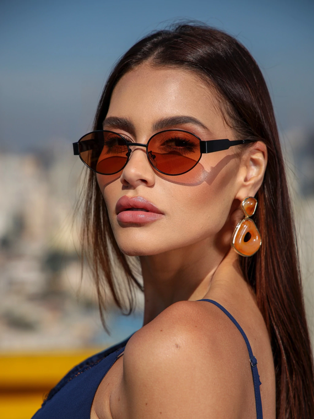 Óculos de sol Vertigo Oval laranja com preto