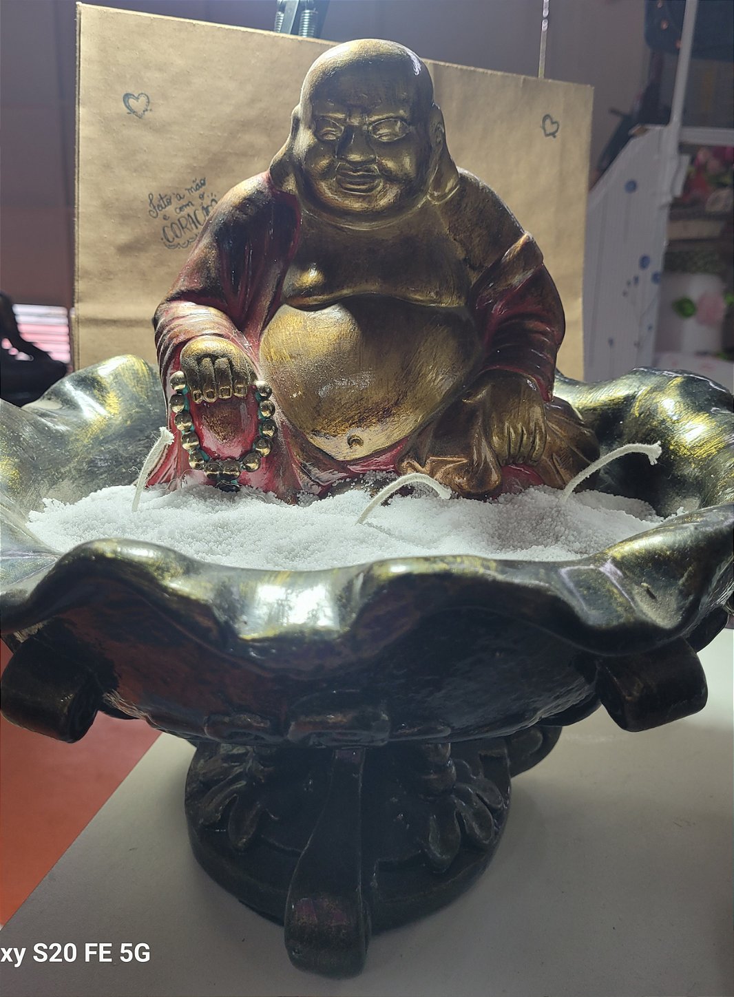 Estatueta de Buda com vela