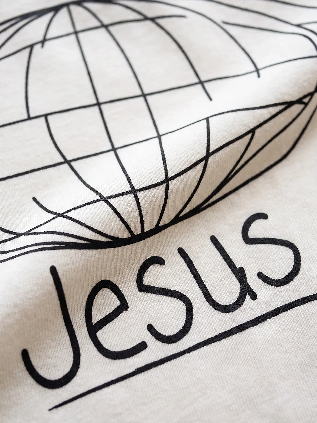 Camiseta Oversized Unissex "Tudo que o mundo precisa é de Jesus"