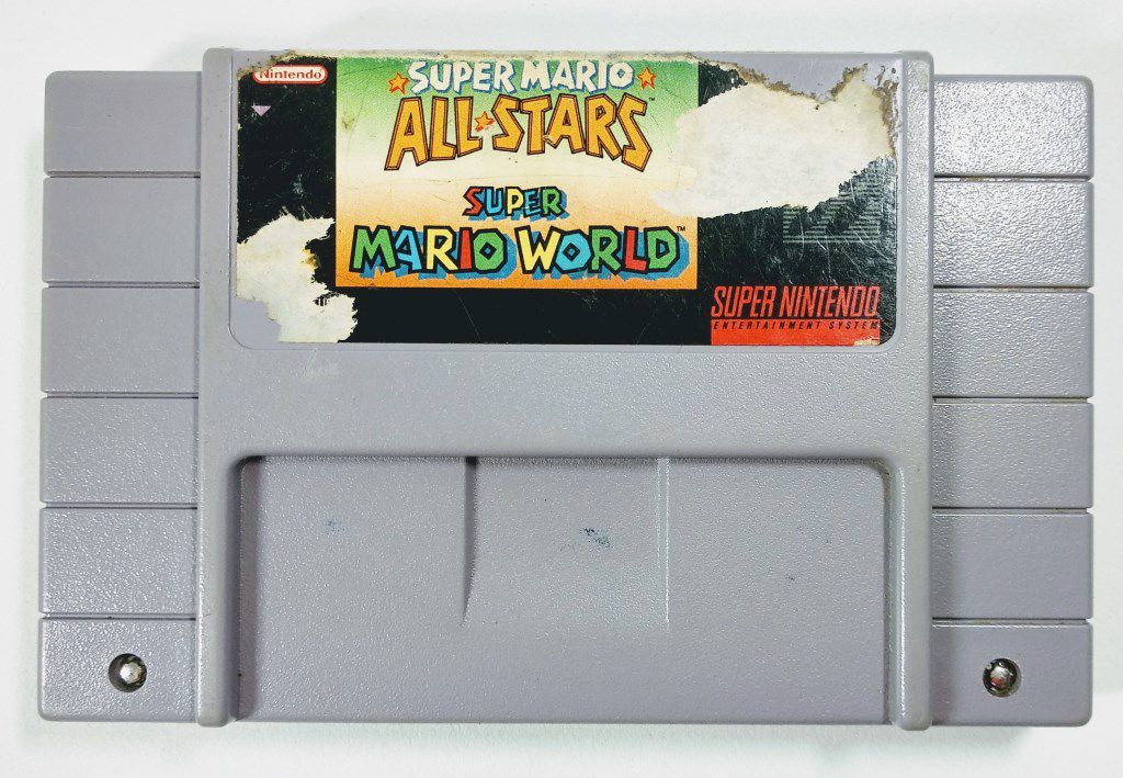 Jogo Super Mario All Stars + Super Mario World Original - SNES - Sebo dos  Games - 10 anos!