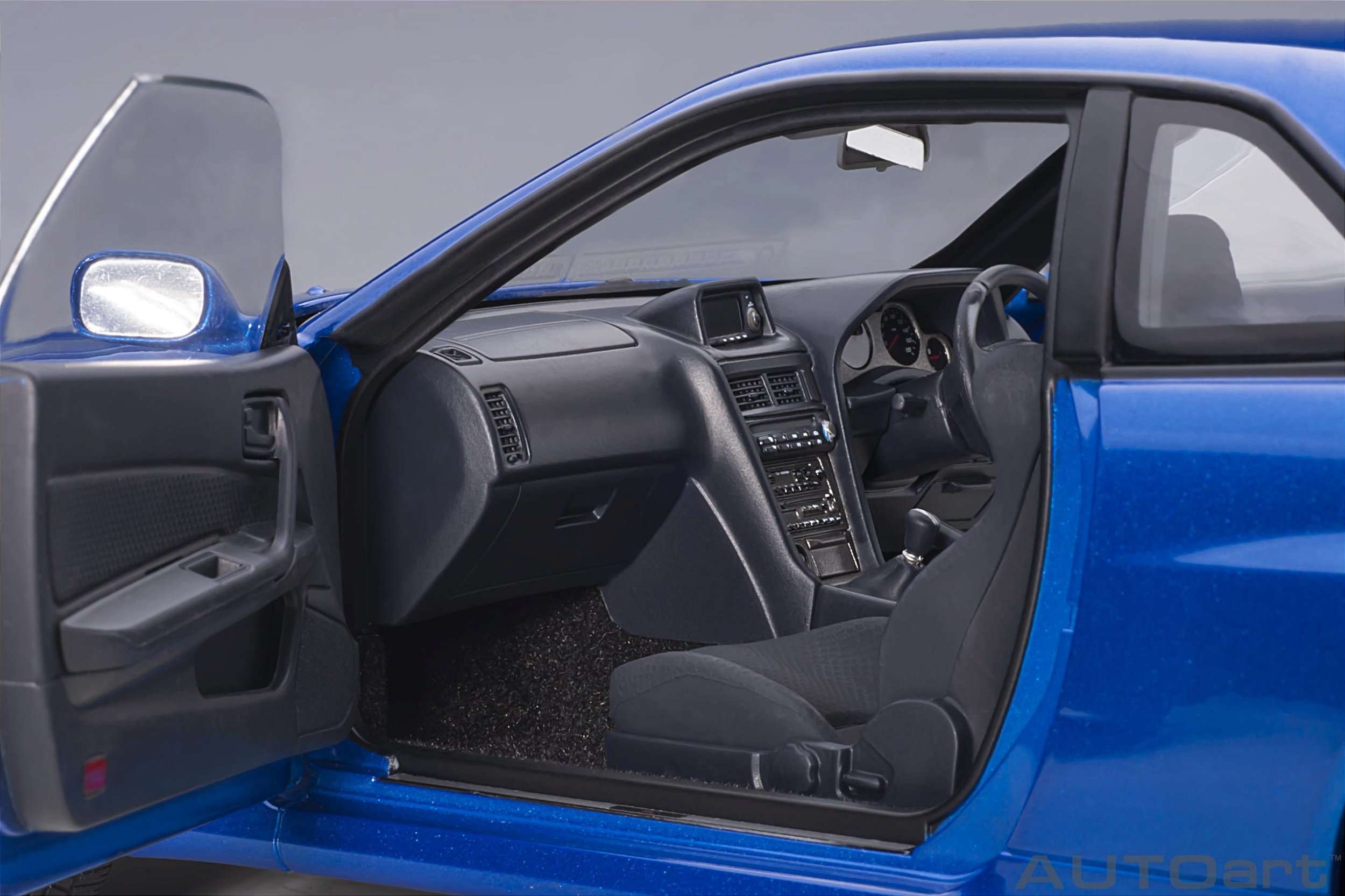 Nissan Skyline GT-R (R34) V-Spec II 1:18 Autoart Azul - 20 anos