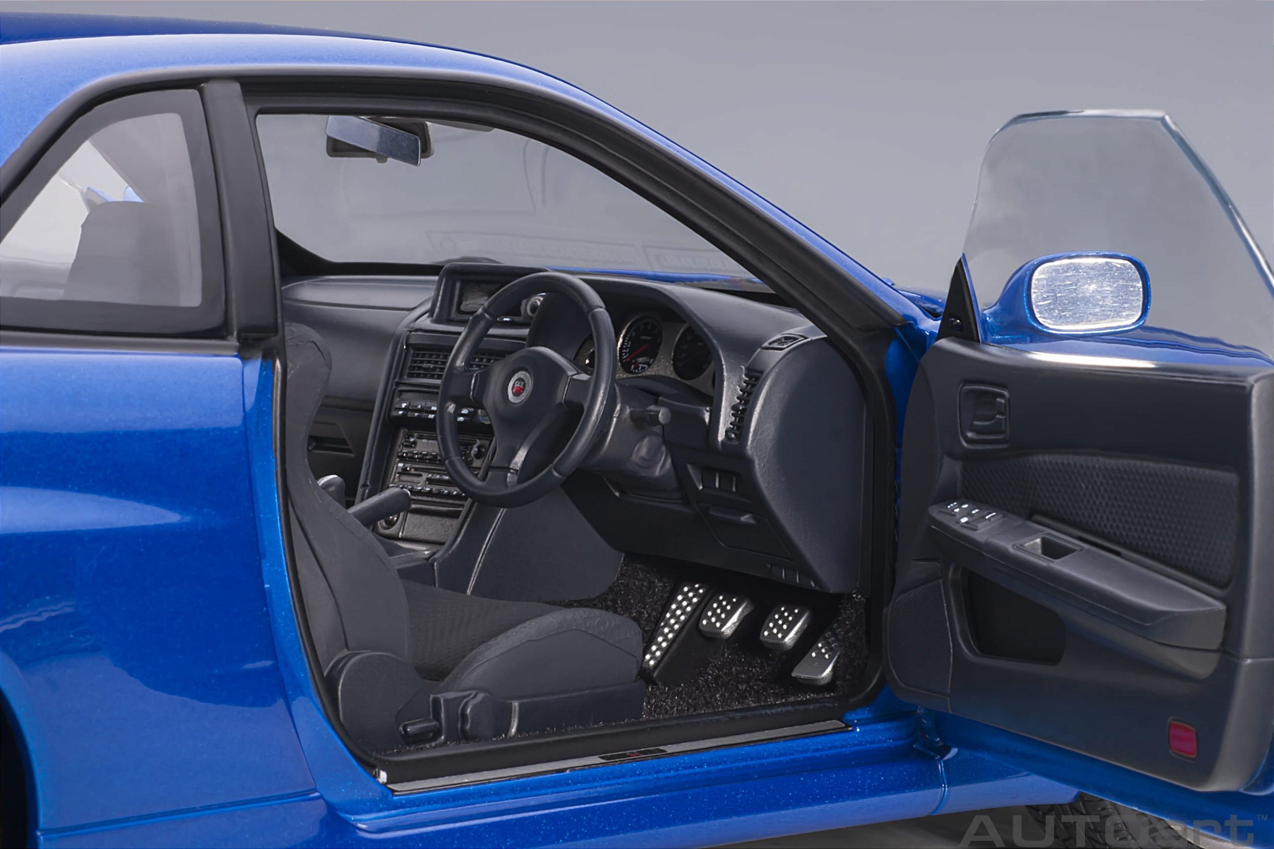 Nissan Skyline GT-R (R34) V-Spec II 1:18 Autoart Azul - 20 anos