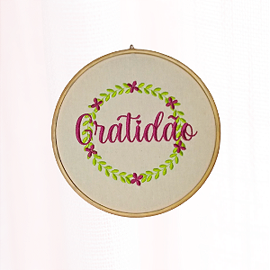 Quadro decorativo emoldurado com o significado da frase obrigado