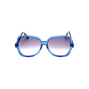 Óculos de Sol Gustavo Eyewear G110 8. Cor: Azul translúcido. Haste animal print. Lentes cinza.