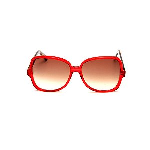 Óculos de Sol Gustavo Eyewear G110 4. Cor: Vermelho translúcido. Haste animal print. Lentes marrom.