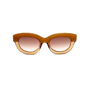 Óculos de sol Gustavo Eyewear G12 3 nas cores doce de leite e âmbar, com as hastes pretas e lentes marrom degrade.