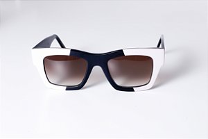 Óculos de Sol Gustavo Eyewear G64 1 na cor vermelha e hastes marrom. Modelo unisex