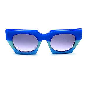 Óculos de Sol Gustavo Eyewear G137 5 em tons de azul e lentes cinza degrade. Novidades