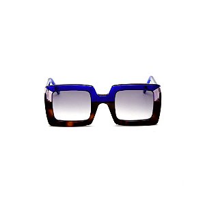 Óculos de sol Gustavo Eyewear G01 8. Cor: Animal print, azul e fumê. Haste azul. Lentes cinza.