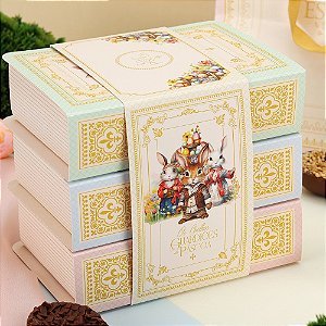 CAIXA 2 OVOS 50GR TRILOGIA: OS COELHOS GUARDIOES DA PASCOA JANGO