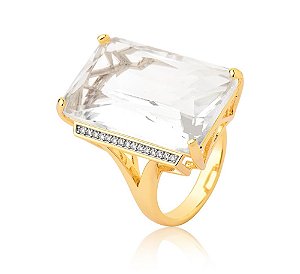 ANEL BAN. DOURADO CRAV. ZIRC BRANCA LATERAL PEDRA BRANCA RETANGULAR
