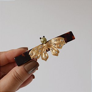 Presilha acetato tartaruga mariposa dourado fosco