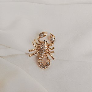 Broche escorpião cristal dourado
