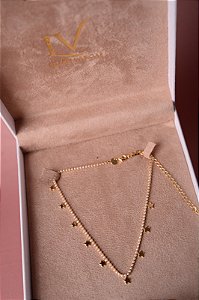 Colar pérolas e estrelas