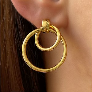 BRINCO CÍRCULOS CRUZADOS DOURADO AÇO 316L⭐️