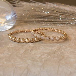 Duo bracelete dourado cravejado com zircônias e navetes cristais