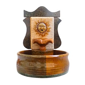 fonte de água de pedra sabão sol
