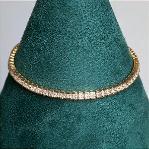 Pulseira riviera cravejada zircônias carrê na cor cristal 2mm de espessura e 18cm de comprimento com banho de ouro 18k
