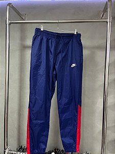 CALÇA NIKE SPORTWEAR TAC TEL(AZUL/VERMELHO)