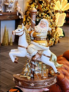 PAPAI NOEL NO CARROSSEL DOURADO E BRANCO COM LED 32CM - PRÉ VENDA 2025