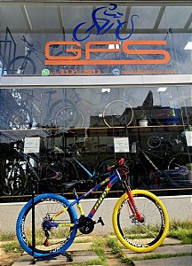 BICICLETA MTB FREERIDE ARO (26) PRO-X MANDRAKE KIT 21 VELOCIDADES FREIO DISC MECÂNICO COR AZUL/VERMELHO/AMARELO