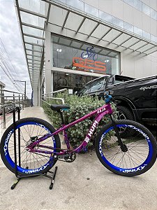 BICICLETA MTB FREERIDE ARO (26) HUPI NAJA KIT SINGLE S/ MARCHA FREIO DISC HIDRÁULICO TRASEIRO SHIMANO COR ROXO/BANCO