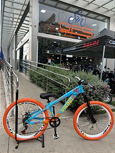 BICICLETA MTB FREERIDE ARO (26) VIKINGX TUFF-25 CAMBIO 7 VELOCIDADES (1X7) FREIO DISC MECÂNICO COR AZUL/LARANJA/BRANCO