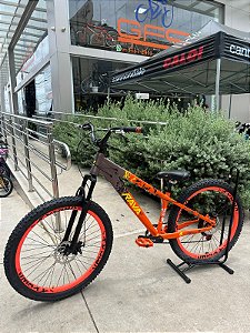 BICICLETA MTB FREERIDE ARO (26) RAVA CAMBIO 7VELOCIDADES (1X7) FREIO DISCO MECÂNICO COR LARANJA/MARRON/AMARELO