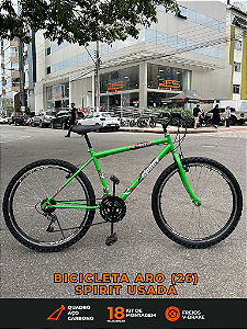 BICICLETA ARO (26) MASCULINA SPIRIT MAX 18 VELOCIDADES FREIOS V-BRAKE COR VERDE (USADA)