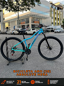 BICICLETA MTB ARO (29) ABSOLUTE HERA 21 VELOCIDADES FREIO A DISCO MECÂNICO TAMANHO 15 (P) COR AZUL/ROSA/VERDE AQUA