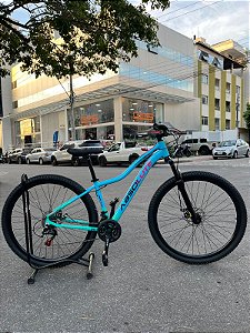 BICICLETA MTB ARO (29) ABSOLUTE HERA 21 VELOCIDADES FREIO A DISCO MECÂNICO TAMANHO 15 (P) COR AZUL/ROSA/VERDE AQUA
