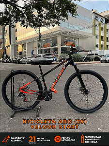 BICICLETA MTB ARO (29) VELOOH START 21 VELOCIDADES FREIO A DISCO MECÂNICO TAMANHO 15 (M) COR PRETO/LARANJA