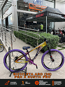 BICICLETA MTB FREERIDE ARO (26) RUSTIC PRO KIT SINGLE S/ MARCHA FREIO DISC HIDRÁULICO TRASEIRO COR CAMALEAO/ROXO