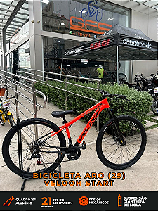BICICLETA MTB ARO (29) VELOOH START 21 VELOCIDADES FREIO A DISCO MECÂNICO TAMANHO 19 (G) COR LARANJA/PRETO