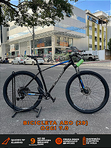 BICICLETA MTB ARO (29) OGGI 7.0 SHIMANO CUES 9 VELOCIDADES FREIO DISC HIDRÁULICO TAMANHO 19 (G) PRETO/AZUL