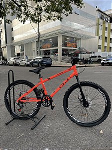 BICICLETA ARO (24) MTB MASCULINA/FEMININA COLLI AIRON 7 VELOCIDADES (1X7) FREIO A DISCO MECÂNICO COR LARANJA NEON