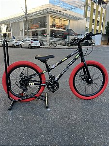 BICICLETA ARO (20) MTB COLLI GRAUZINHA 7 VELOCIDADES (1X7) FREIO A DISCO MECÂNICO COR PRETO PNEU VEMELHO