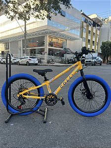 BICICLETA ARO (20) MTB COLLI GRAUZINHA 7 VELOCIDADES (1X7) FREIO A DISCO MECÂNICO COR AMARELO PNEU AZUL