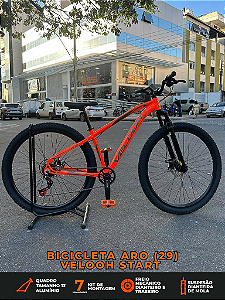 BICICLETA MTB ARO (29) VELOOH START 7 VELOCIDADES (1X7) FREIO A DISCO MECÂNICO TAMANHO 13 (PP) COR LARANJA