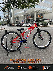BICICLETA MTB FREERIDE ARO (26) VIKINGX TUFF-25 KIT 7 VELOCIDADES FREIO A DISCO MECÂNICO COR VERMELHO/AZUL/BRANCO
