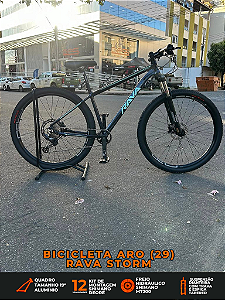 BICICLETA ARO (29) RAVA STORM KIT 12 VELOCIDADES (1X12) FREIO DISC HIDRAULICO SHIMANO MT200 TAMANHO 19 (G) CAMALEÃO