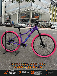 BICICLETA MTB ARO (29) ABSOLUTE HERA 7 VELOCIDADES (1X7) FREIO A DISCO MECÂNICO TAMANHO 15 (P) COR ROXO/ROSA