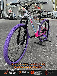 BICICLETA MTB ARO (29) ABSOLUTE HERA 7 VELOCIDADES (1X7) FREIO A DISCO MECÂNICO TAMANHO 15 (P) COR BRANCO/ROSA/ROXO