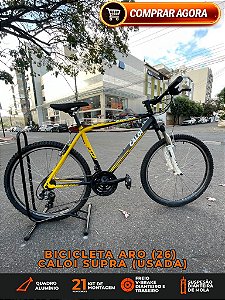 BICICLETA ARO (26) MASCULINA MTB CALOI SUPRA 21 VELOCIDADES (3X7) FREIOS V-BRAKE COR PRETO/AMARELO (USADA)