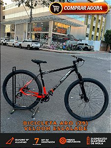 BICICLETA MTB ARO (29) VELOOH ESCALADE 7 VELOCIDADES (1X7) FREIO A DISCO MECÂNICO TAMANHO 19 (G) COR PRETO/LARANJA NEON