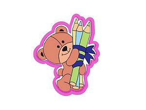 Cortador de biscoito urso segurando lápis