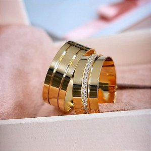 PAR DE ALIANÇAS EM OURO 18k MODELO MEDELINE - 7MM- PEDRAS  EM ALTO RELEVO